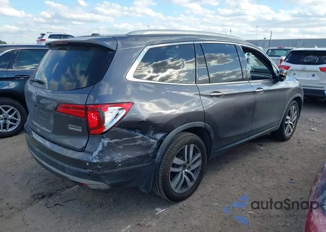 2018 Honda Pilot Touring z USA, uszkodzony, nr VIN 5FNYF5H94JB003651